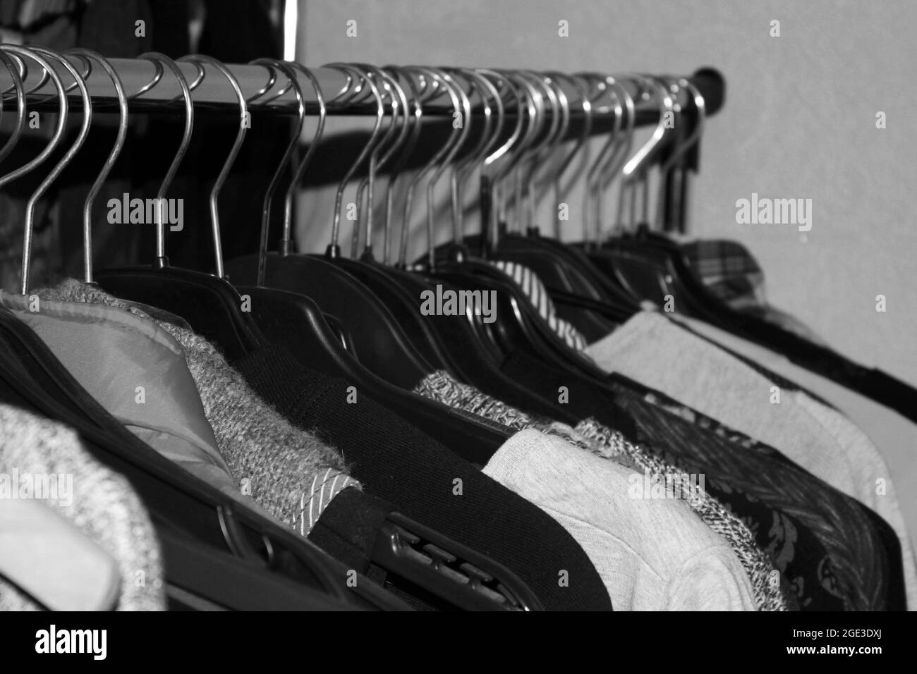 Clothes on a hanger. Black and white photo Stock Photo