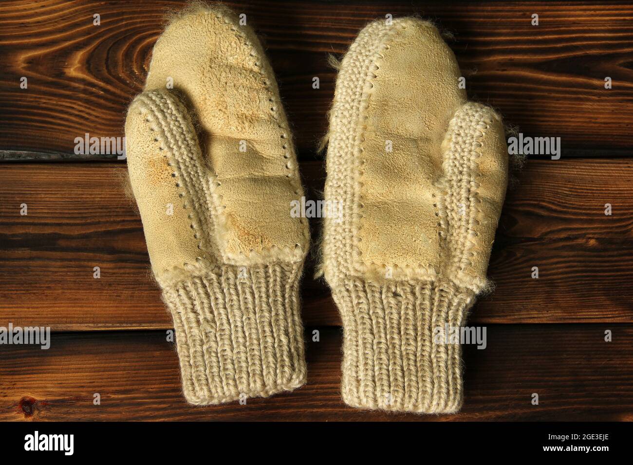 Mittens on a wooden background. Winter clothes Stock Photo