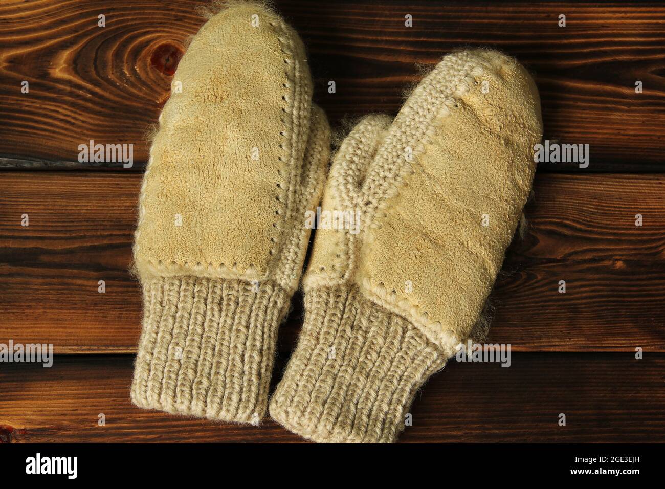 Mittens on a wooden background. Winter clothes Stock Photo