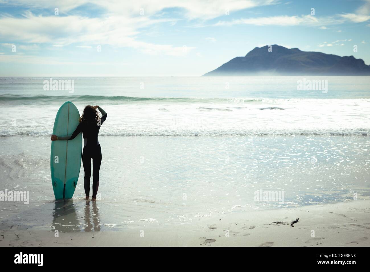 Woman holding surfboard in hi-res stock photography and images - Alamy