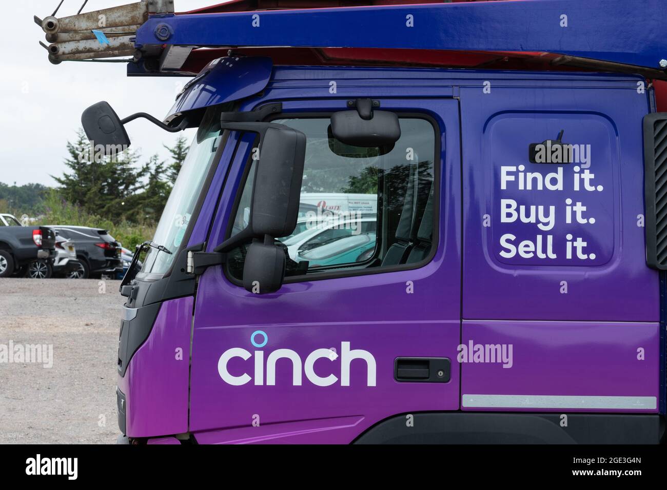 Cinch cars lorry truck transporter vehicle. Online used car sales business. Stock Photo