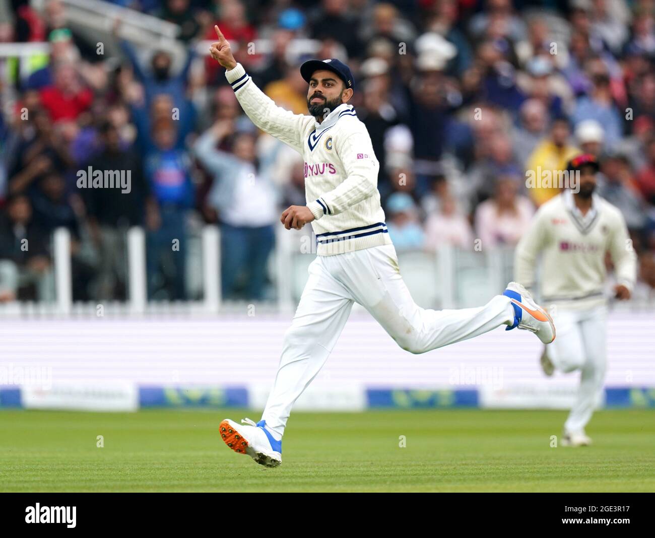 India's Virat Kohli celebrates catching the ball from England's Joe ...