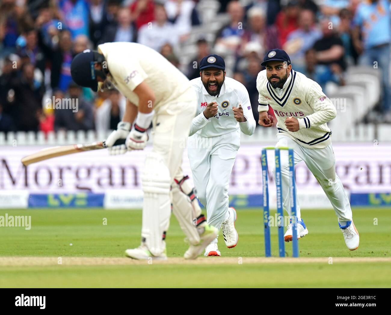 India's Virat Kohli (right) celebrates catching the ball from England's ...