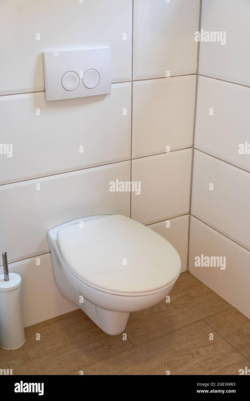 Modern Toilet Seat in Clean White Bathroom Stock Photo