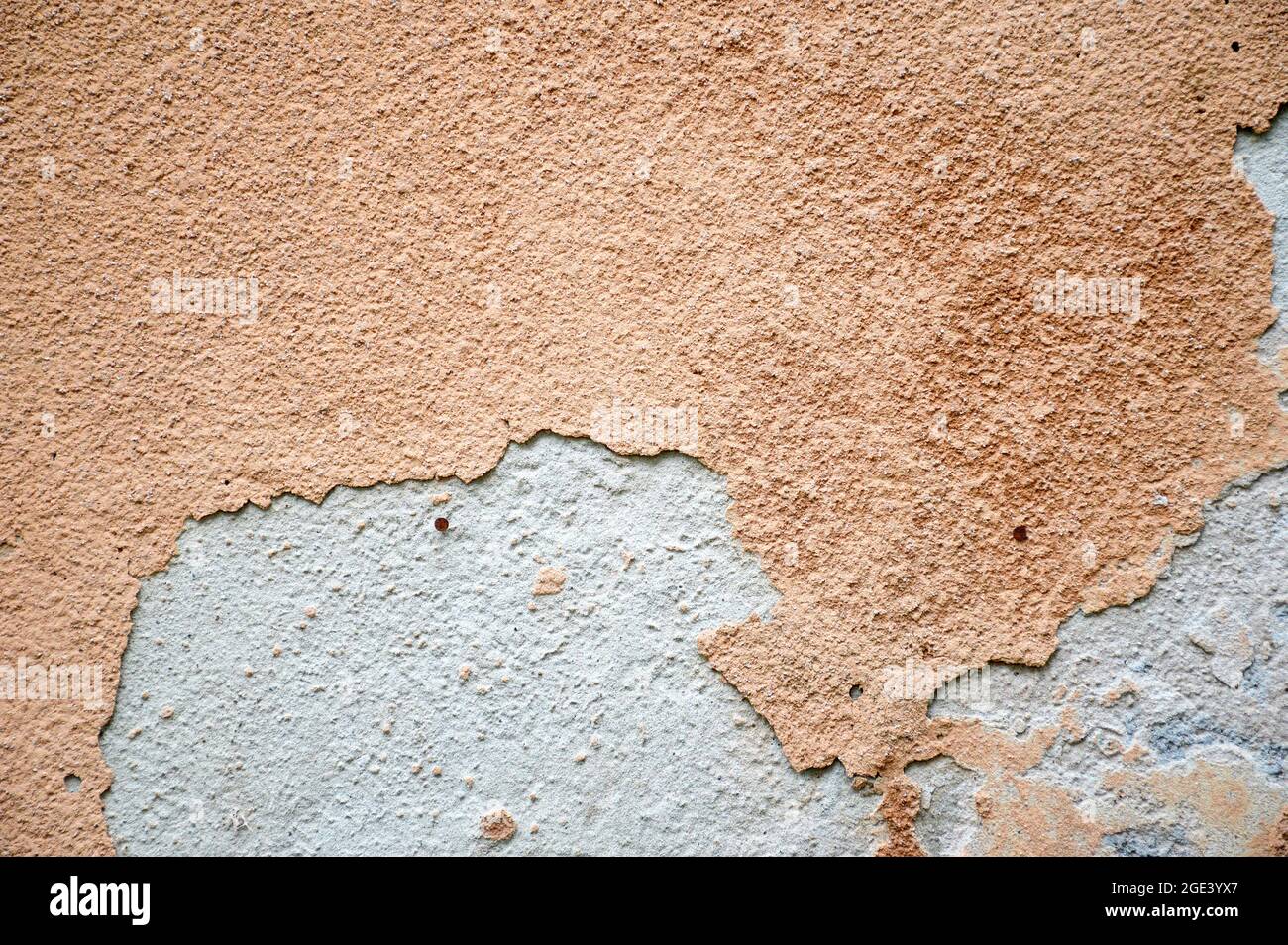 Old concrete wall with peeling plaster Stock Photo