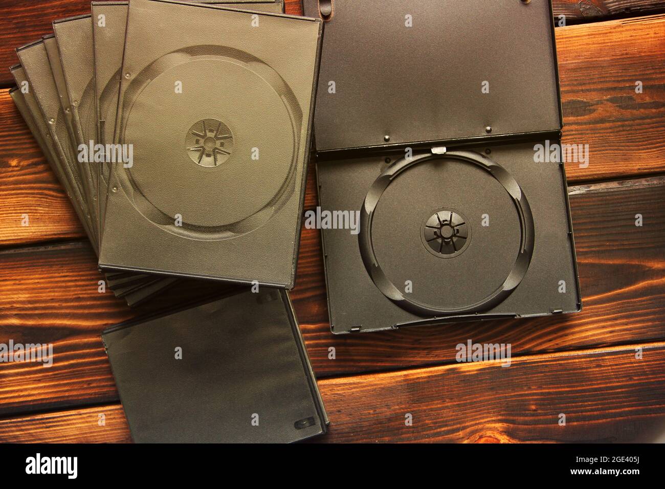 Boxes for CD drives on a wooden background Stock Photo