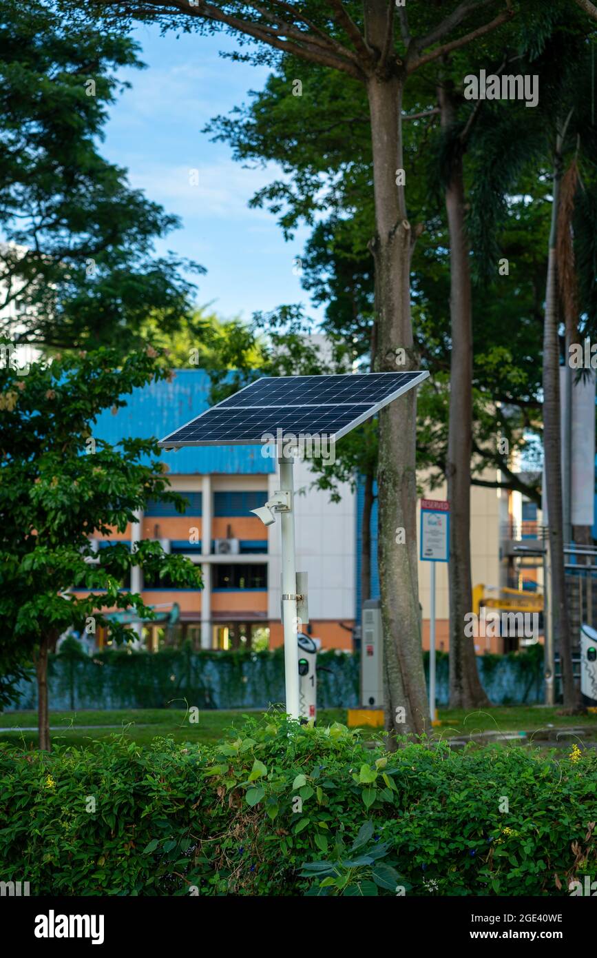 Security cctv camera powered by solar panel, Singapore Stock Photo