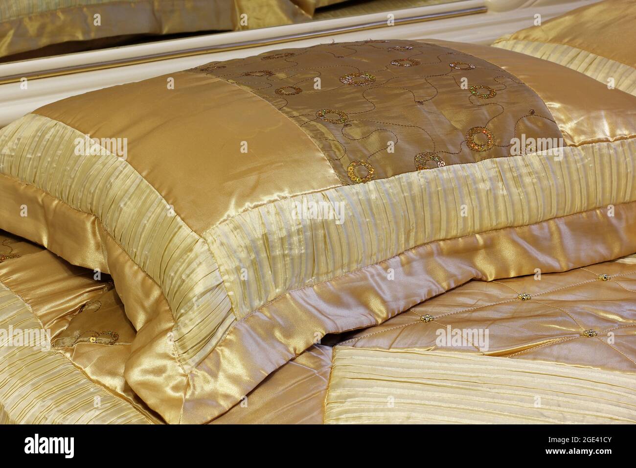 Gold pillow. Luxury bedding Stock Photo