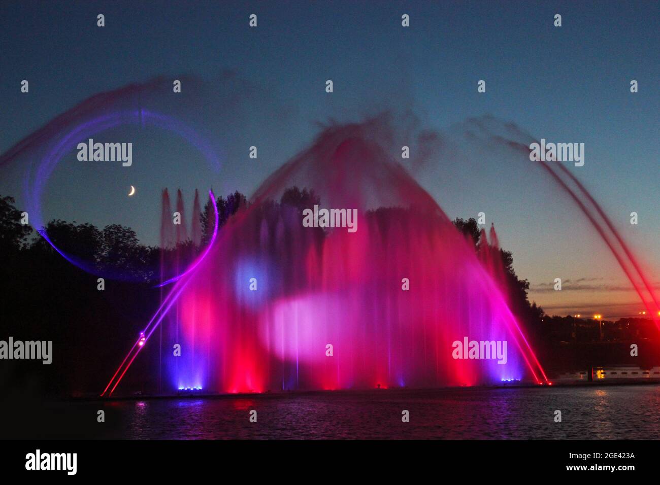 Colored fountain in the night city Stock Photo - Alamy
