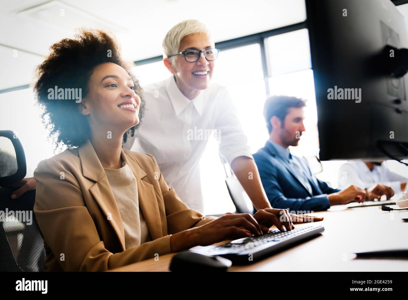 Portrait of successful business team working in office Stock Photo - Alamy