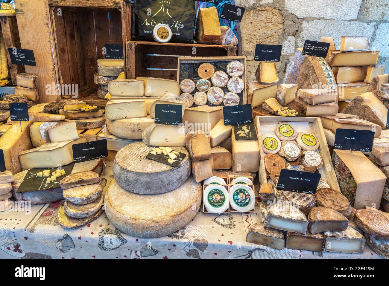 Typical products for sale on the stalls at the Annecy traditional market. Annecy, Savoie department, Auvergne-Rhône-Alpes region, France, Europe Stock Photo