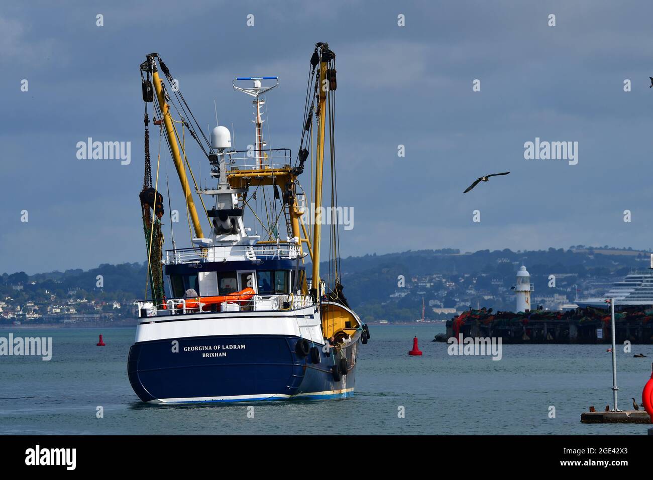 On a mild early morning on high tide Georgina of Ladram fishing trawler is seen leaving Brixham Harbour. Picture Credit Robert Timoney/AlamyStockPhoto Stock Photo