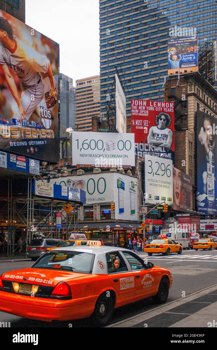 USA New York NYC Manhattan Times Square at the junction of 7th Avenue and Broadway below buildings with advertising Stock Photo