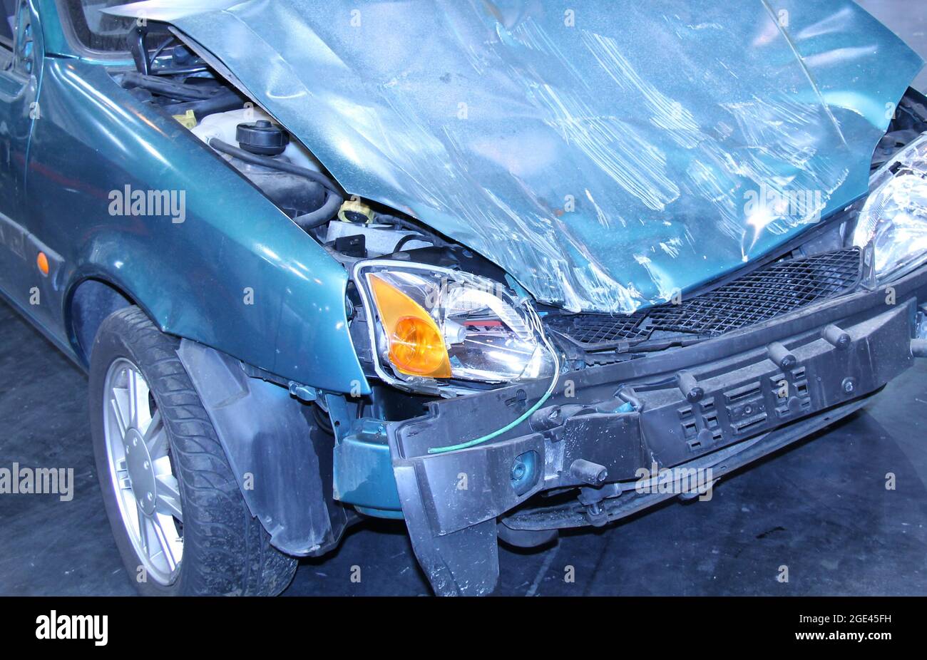 The Smashed Front and Bonnet of a Crashed Car. Stock Photo