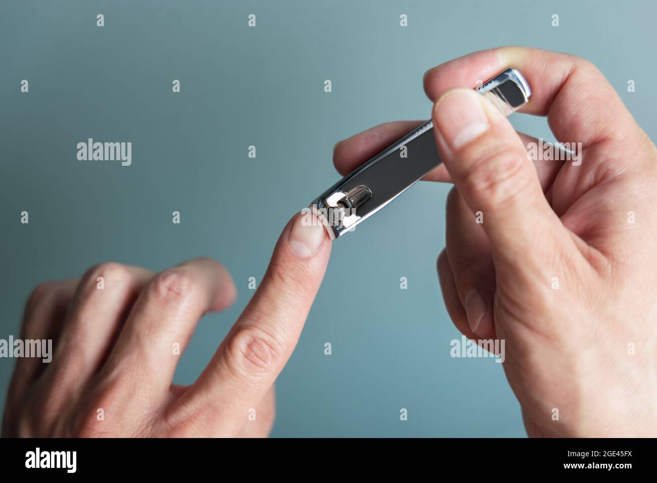 Man cutting nails using nail clipper. Manicure Stock Photo Alamy