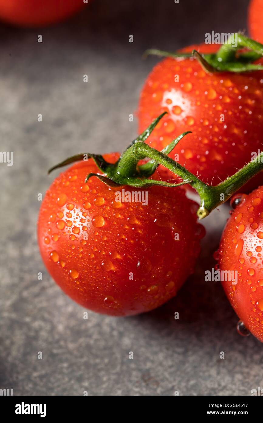 Healthy Organic Red Cherry Tomatoes in a Bunch Stock Photo - Alamy