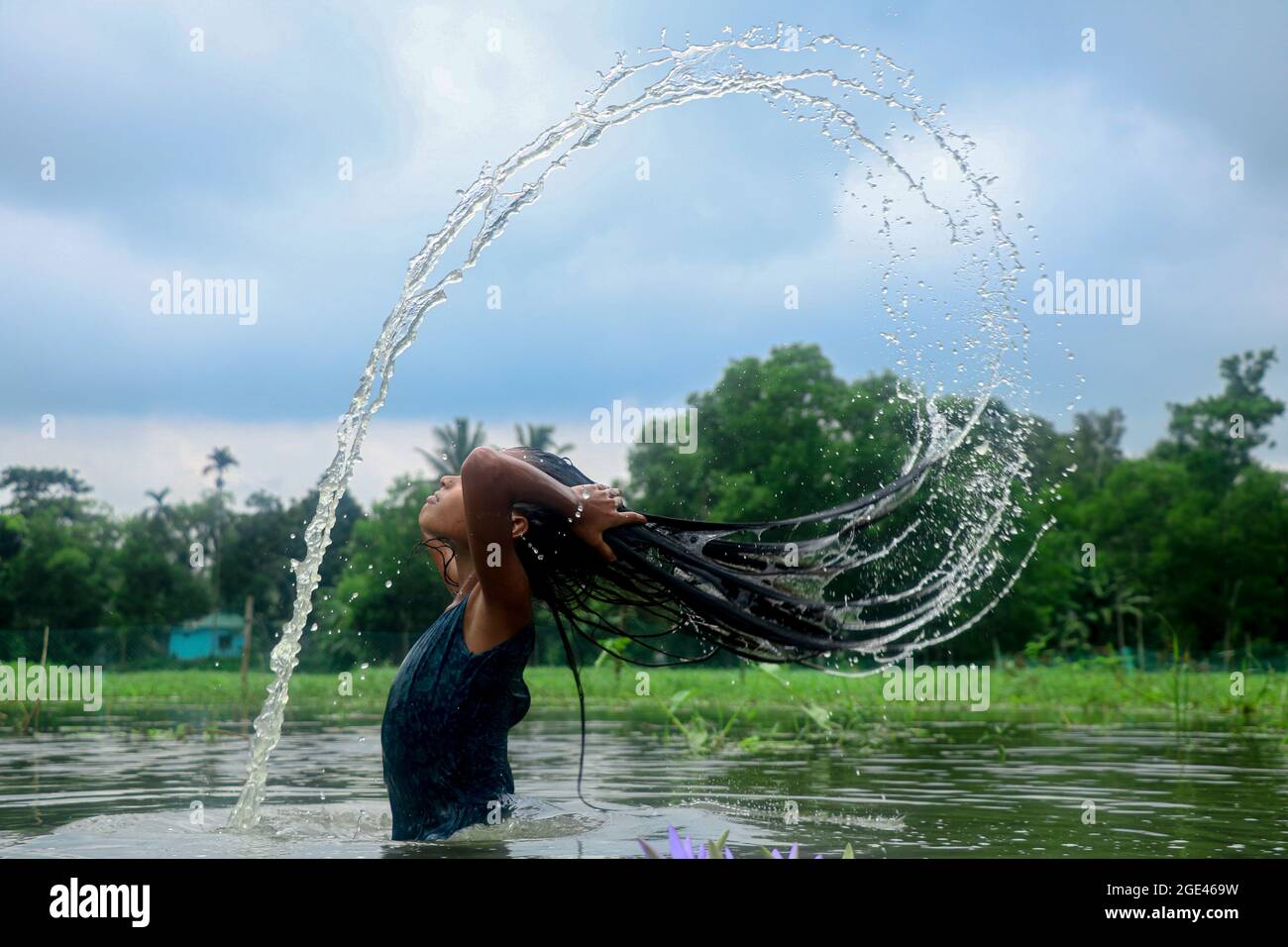 Children beauty with amazing splash of water . Stock Photo