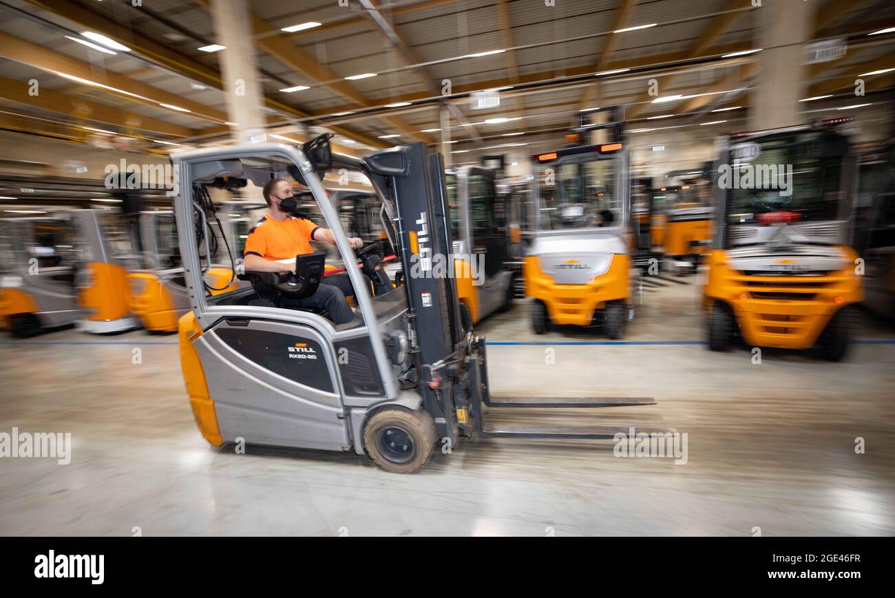 Hamburg, Germany. 04th Aug, 2021. A forklift truck travels between new