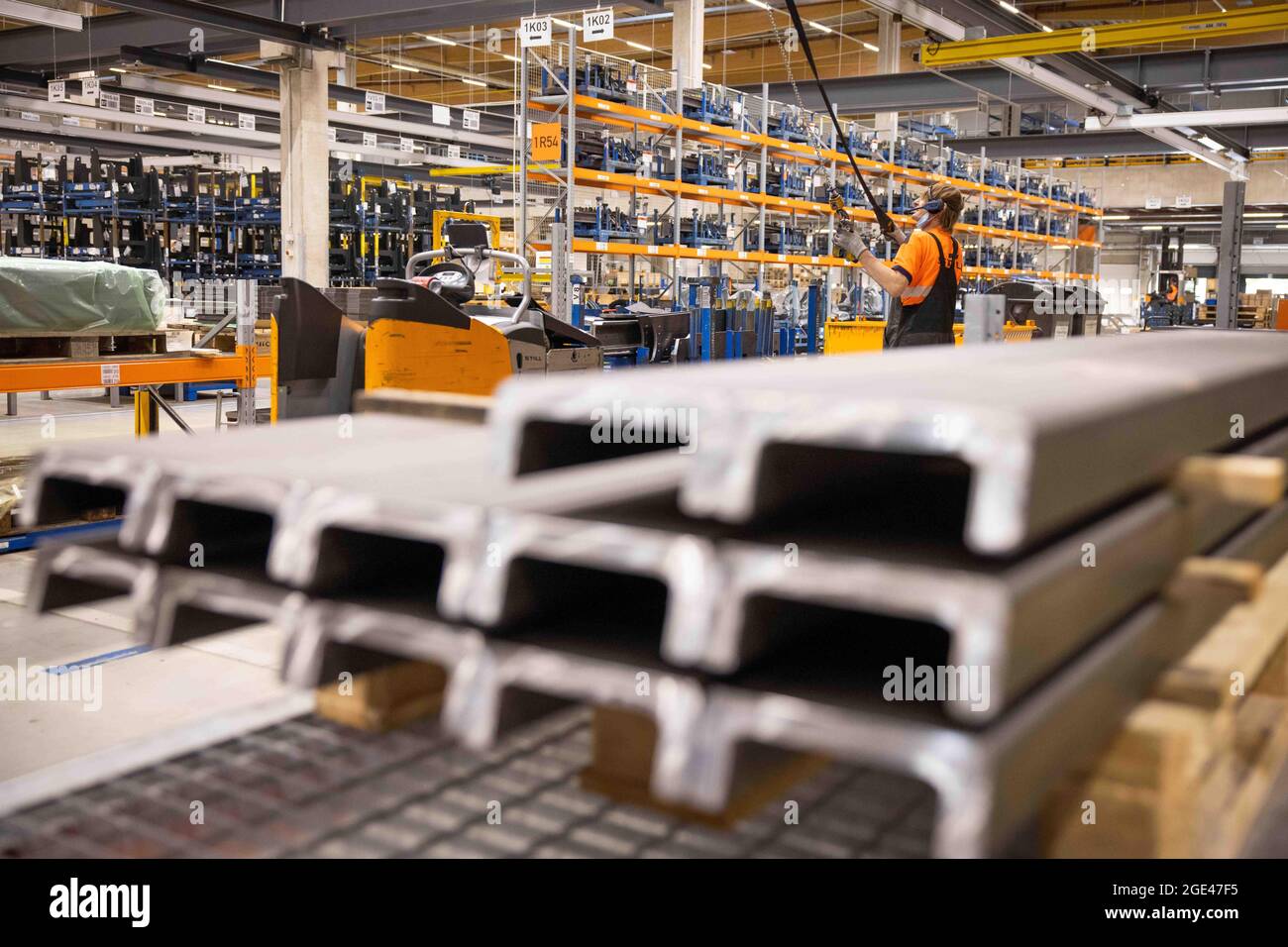 Hamburg, Germany. 04th Aug, 2021. An employee works on construction parts  and intermediate products in a logistics terminal of Still, a manufacturer  of forklift trucks, warehouse equipment and intralogistics systems, in  Hamburg.