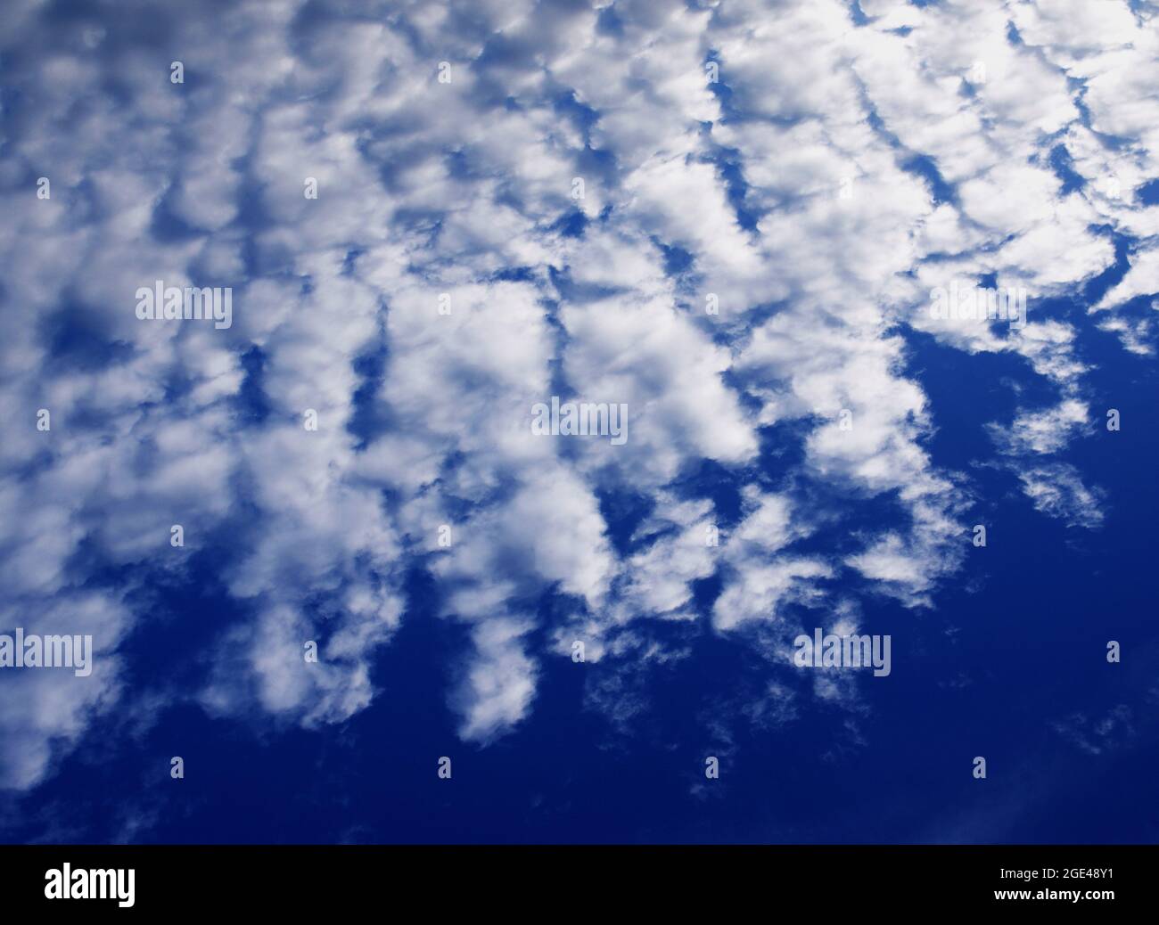 Blue sky background with clouds. Background with clouds on blue sky. Stock Photo