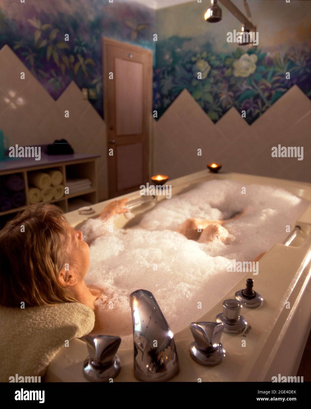 Woman relaxing in bathtub with bubble bath soap Stock Photo