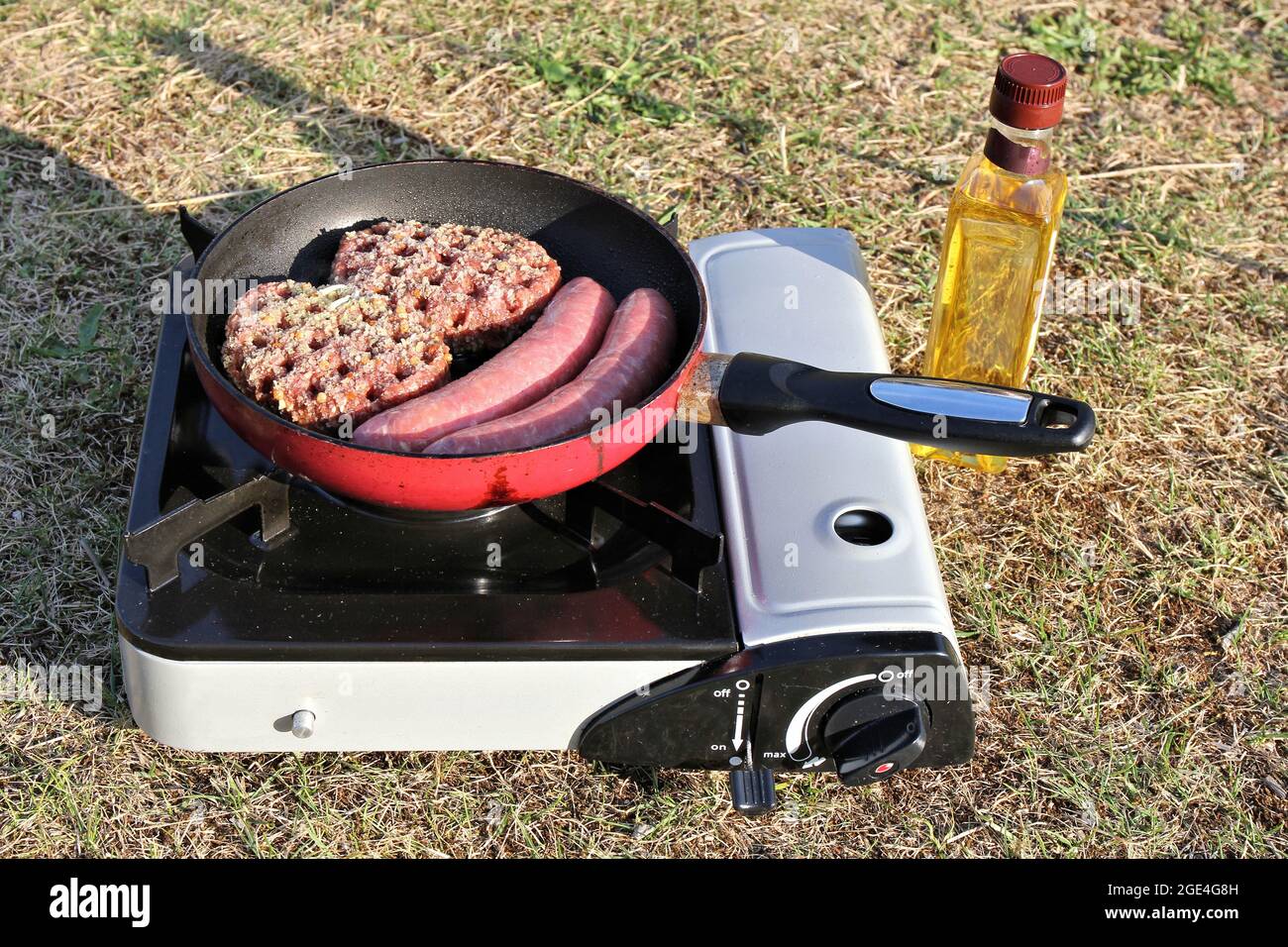 outdoor cooking with camp cooker Stock Photo Alamy