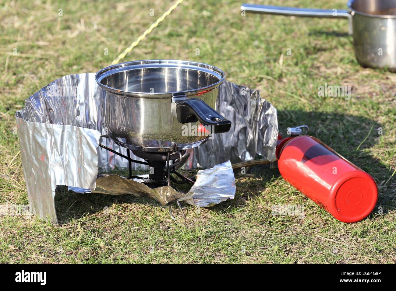 outdoor cooking with camp cooker Stock Photo Alamy