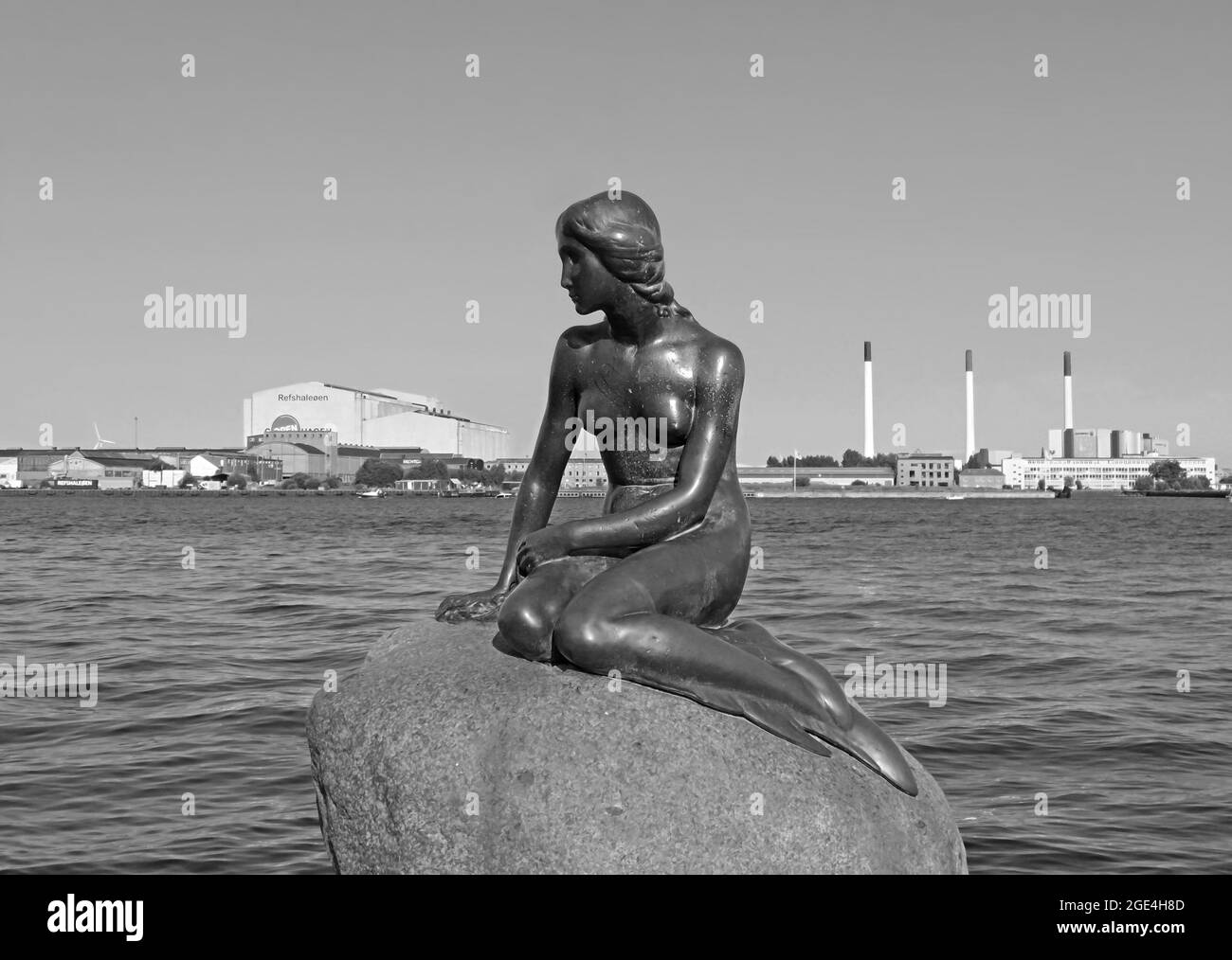 Statue of the Little Mermaid at the Waterside of Langelinie Promenade, Copenhagen, Denmark in Monochrome Stock Photo