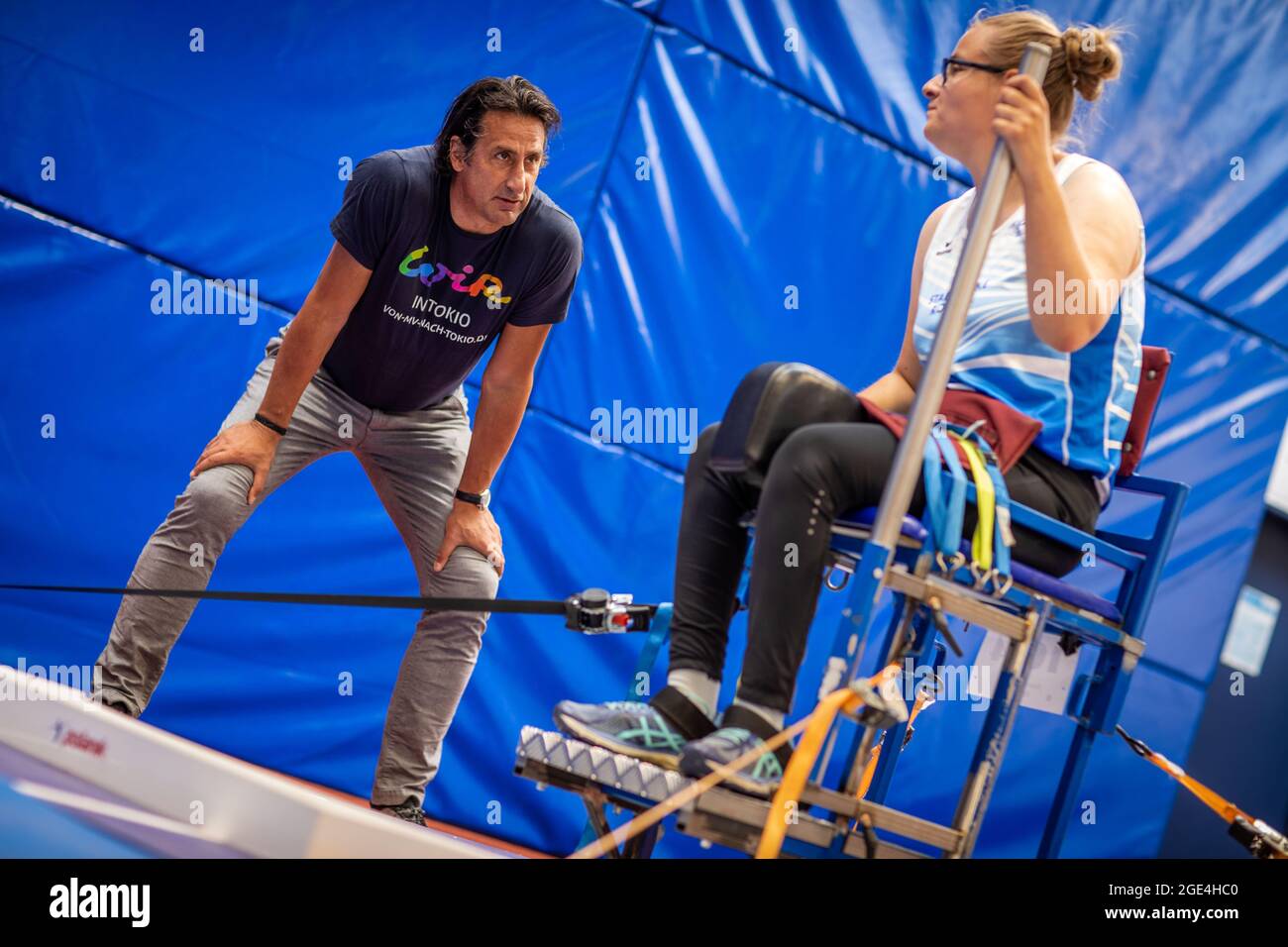 Rostock, Germany. 11th Aug, 2021. Christian Schenk, Olympic decathlon  champion in Seoul in 1988, trains with Hanna Wichmann from 1.LV Rostock in  the shot put as state coach of the para-athletes in