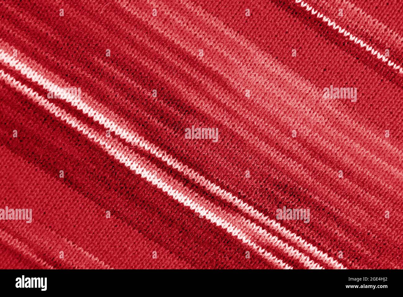 Texture of Gradient Red Striped Alpaca Knitted Wool Fabric in Diagonal Patterns for Abstract Background Stock Photo