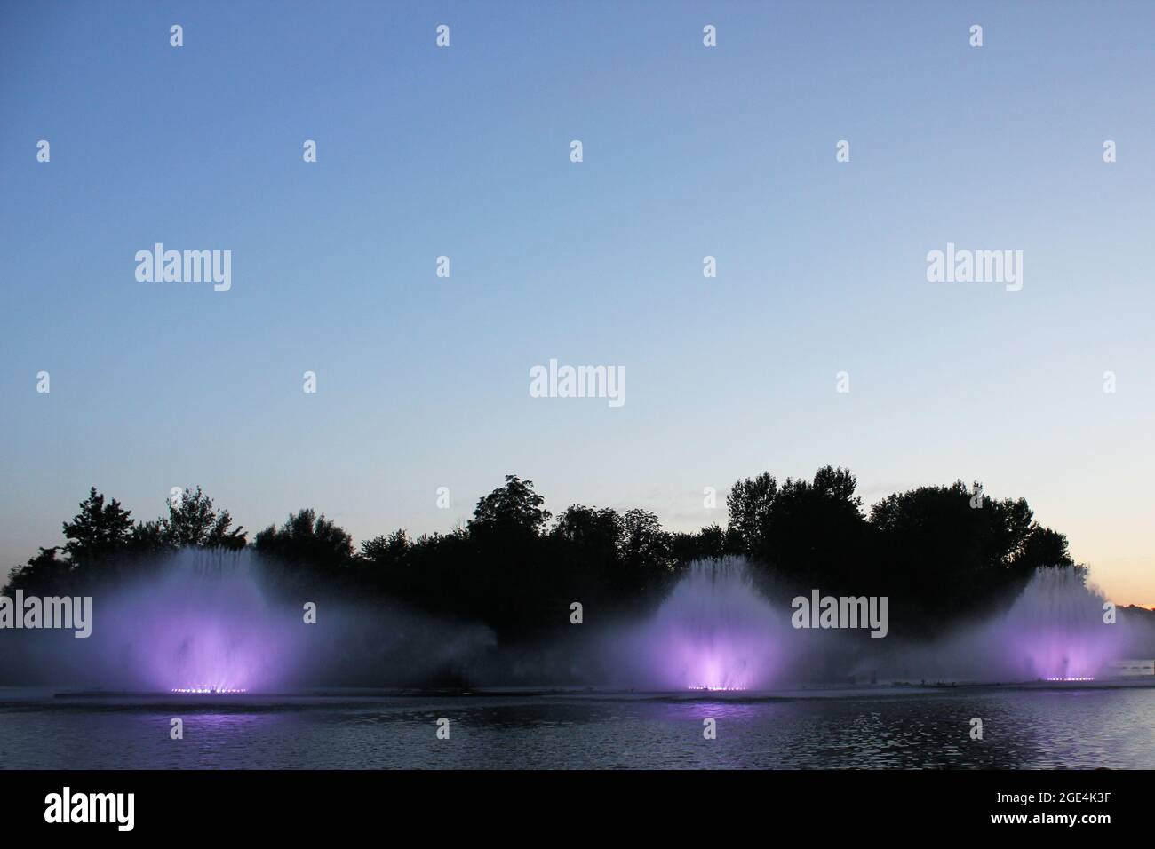 Colored fountain in the night city Stock Photo - Alamy