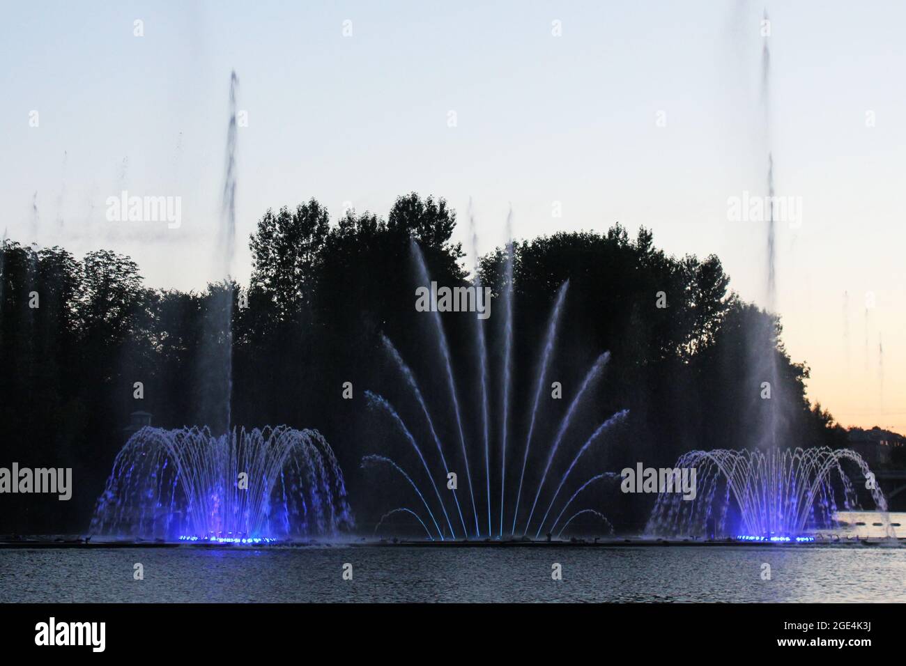 Colored fountain in the night city Stock Photo - Alamy