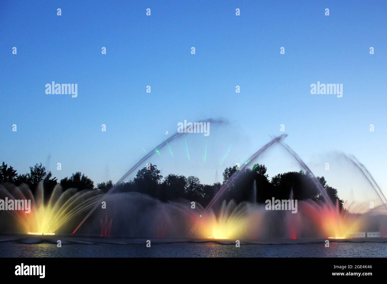 Colored fountain in the night city Stock Photo - Alamy