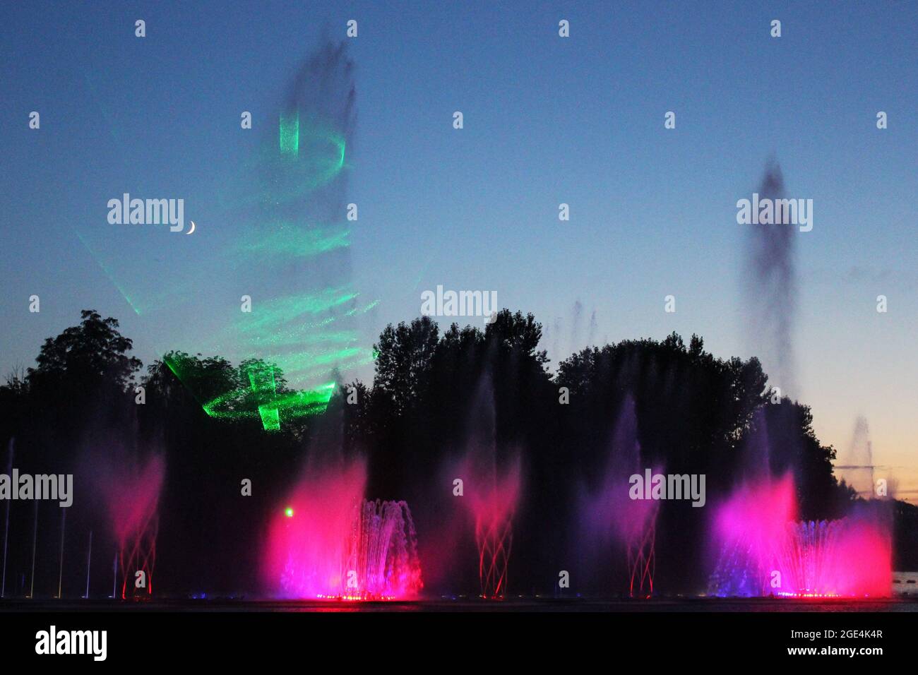 Colored fountain in the night city Stock Photo - Alamy