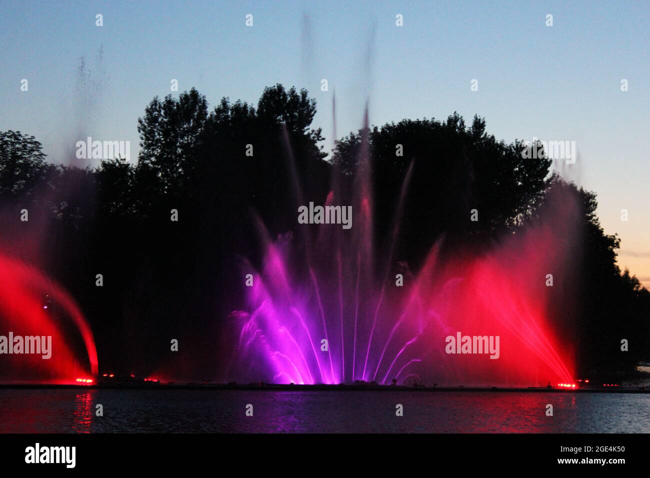 Colored fountain in the night city Stock Photo - Alamy