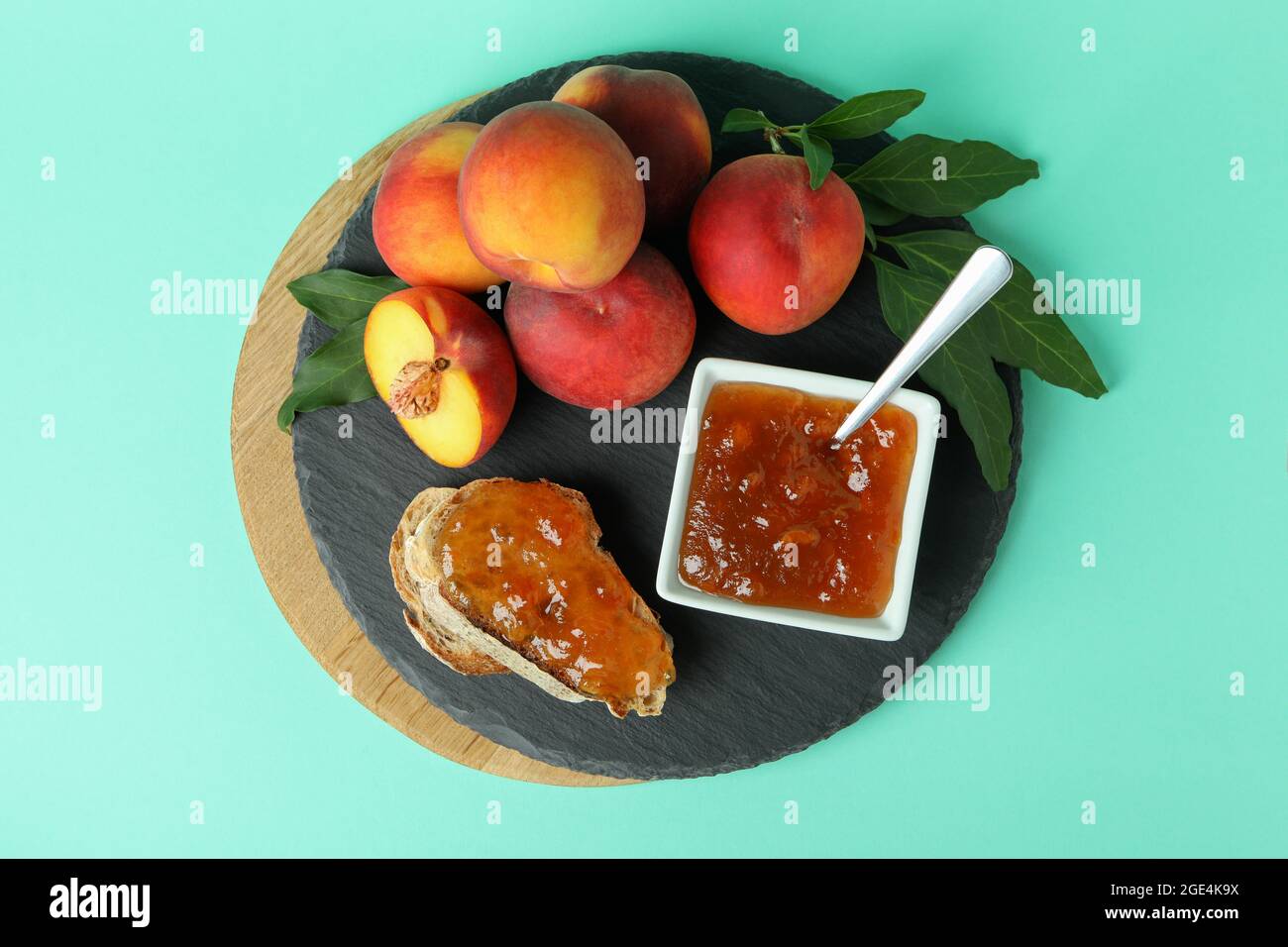 Sandwich with peach jam and ingredients on mint background Stock Photo Alamy