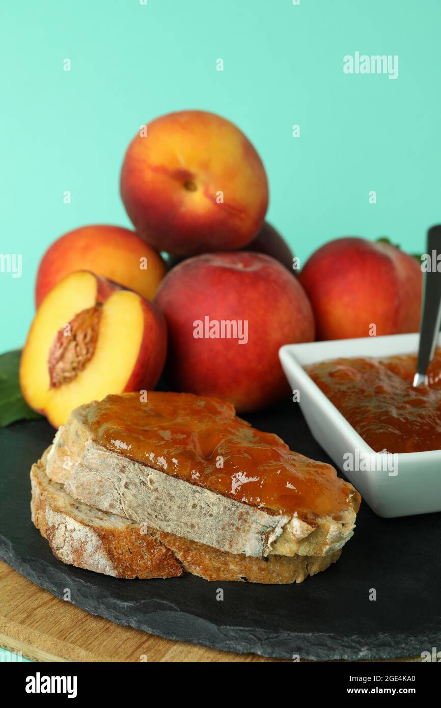 Sandwich with peach jam and ingredients on mint background Stock Photo Alamy