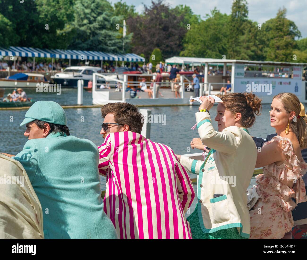 Spectators watch the rowing from the Steward's Enclosure,men wearing rowing club blazers, at the Henley Royal Regatta 2021, Henley-onThames, England Stock Photo