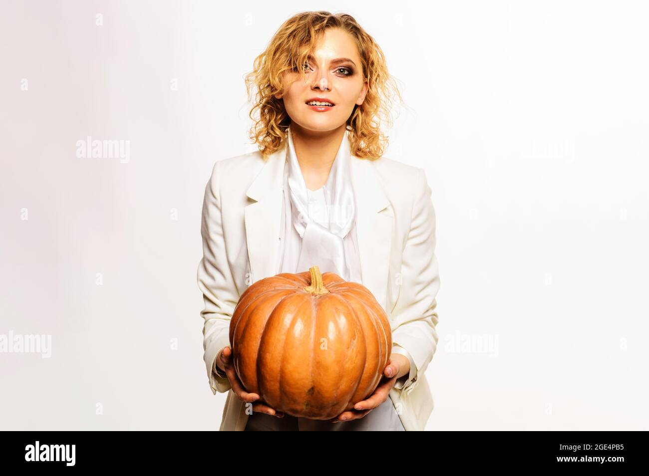 Happy woman with halloween pumpkin. Celebrating Thanksgiving day. Trick or treat. 31 October. Stock Photo