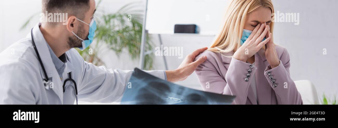 doctor with lungs fluorography calming upset woman crying in medical ...