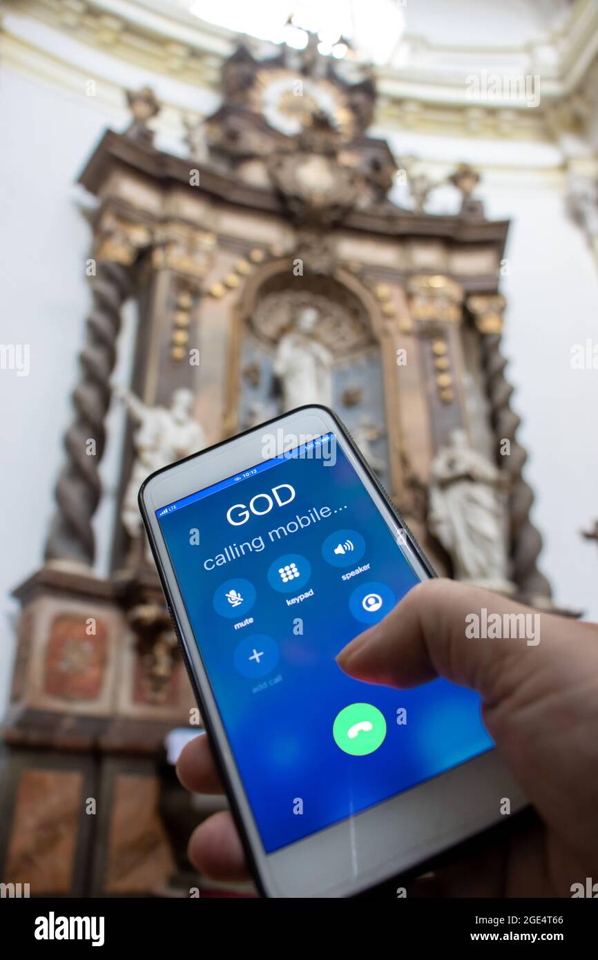 Calling God by mobile phone in front of the altar in the church Stock Photo  - Alamy