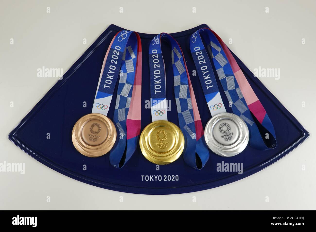 Tokyo 2020 Olympic gold, silver and bronze medals on a tray before a medal presentation Stock Photo