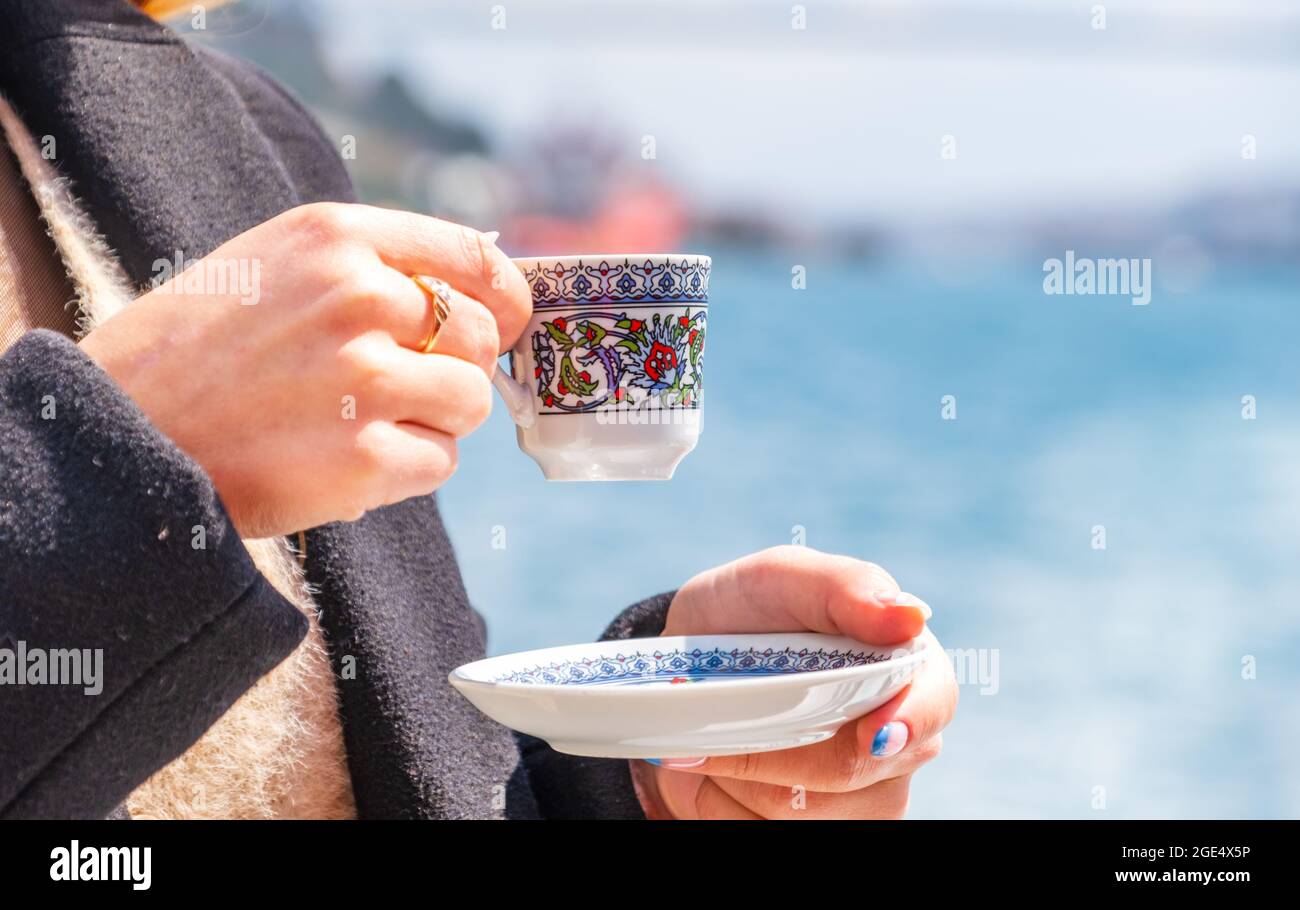 hand with turkish coffee cup and flag. Travel concept Stock Photo