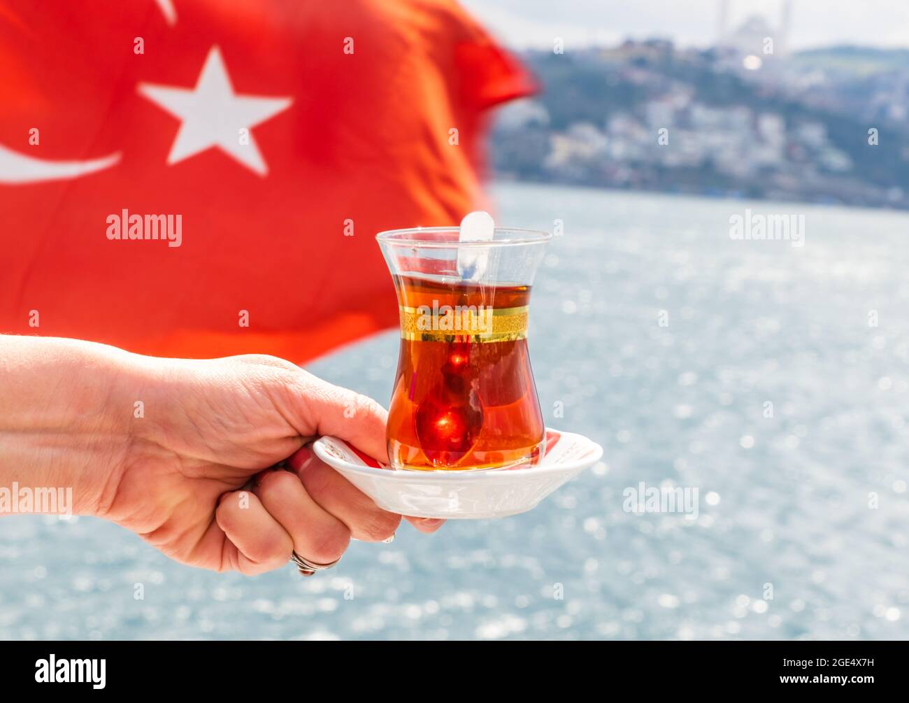 Turkish Tea Flag hand with turkish tea cup and flag. Travel concept Stock Photo - Alamy