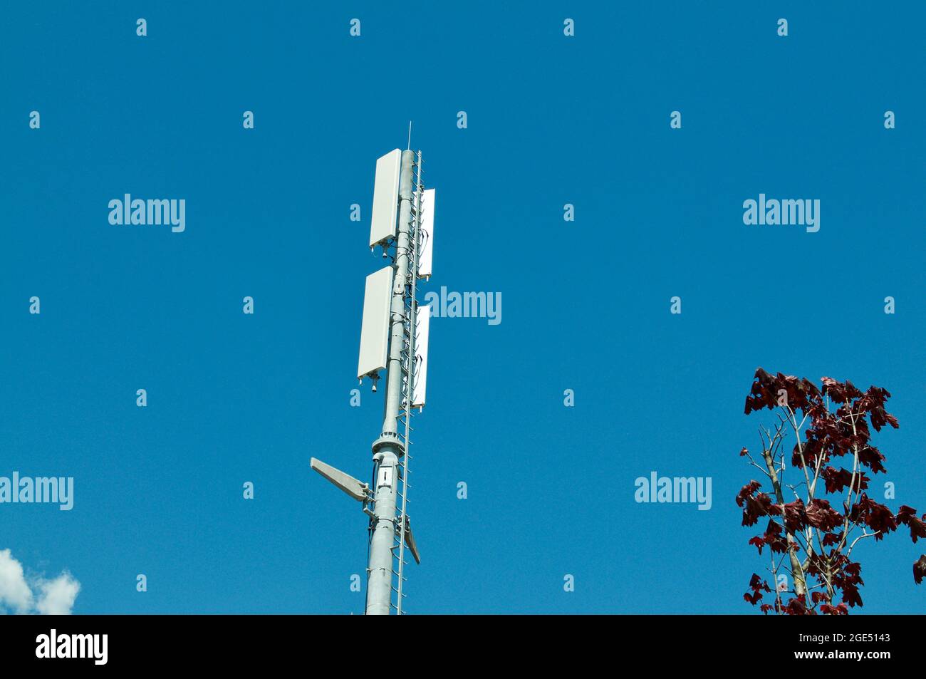 View of a Telecommunication tower antenna of 4G and 5G mobile communication system located on a building in Bellinzona, Switzerland Stock Photo
