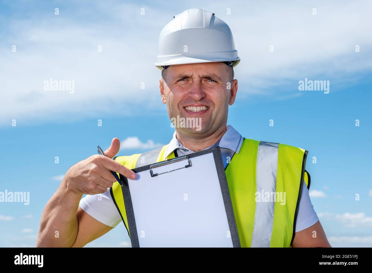 Filing Foreman Adult foreman showing blank document Stock Photo - Alamy