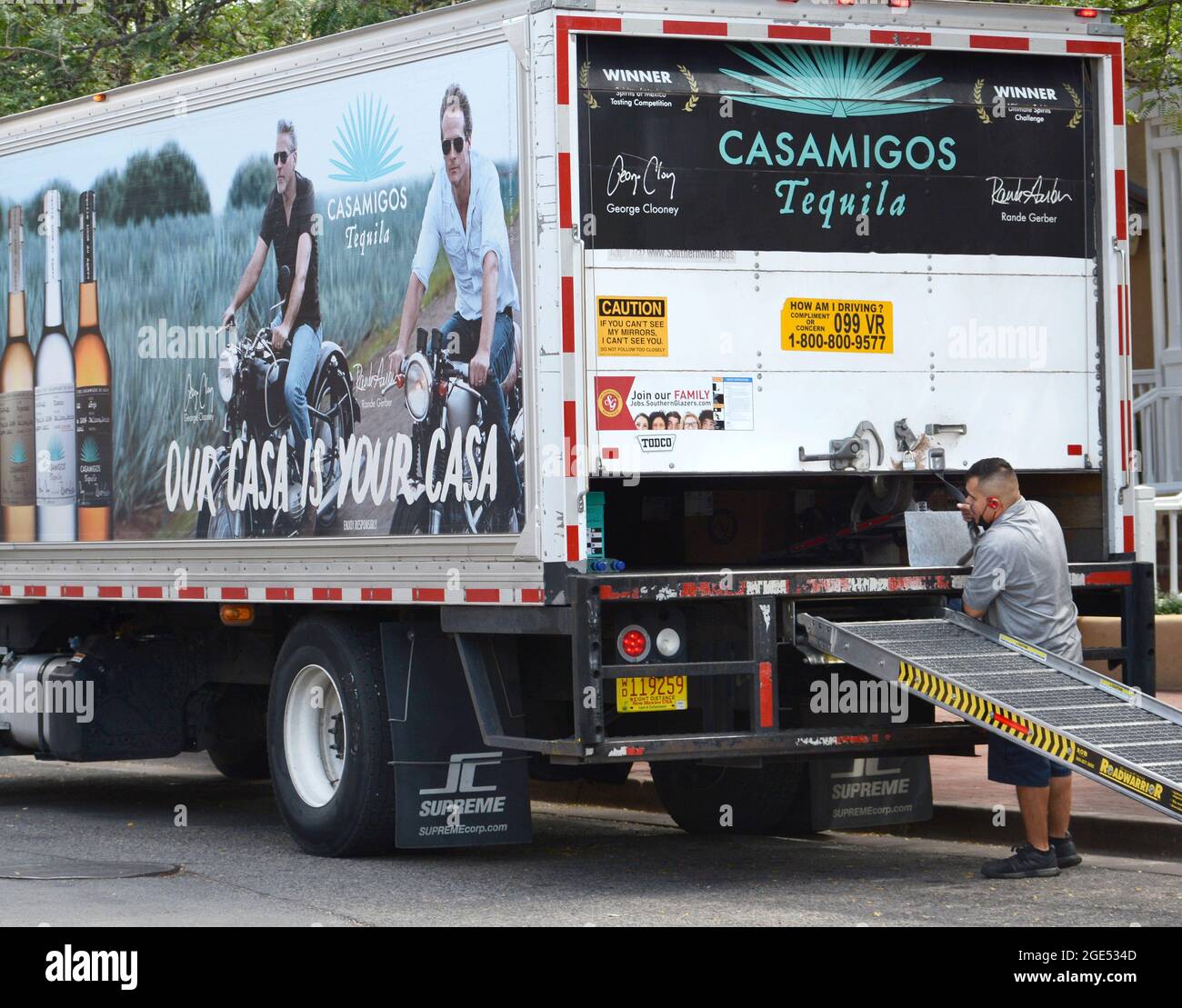 A truck delivers Casamigos tequila to a bar in Santa Fe, New Mexico. Casamigos, founded by George Clooney and Rande Gerber, is now owned by Diageo. Stock Photo