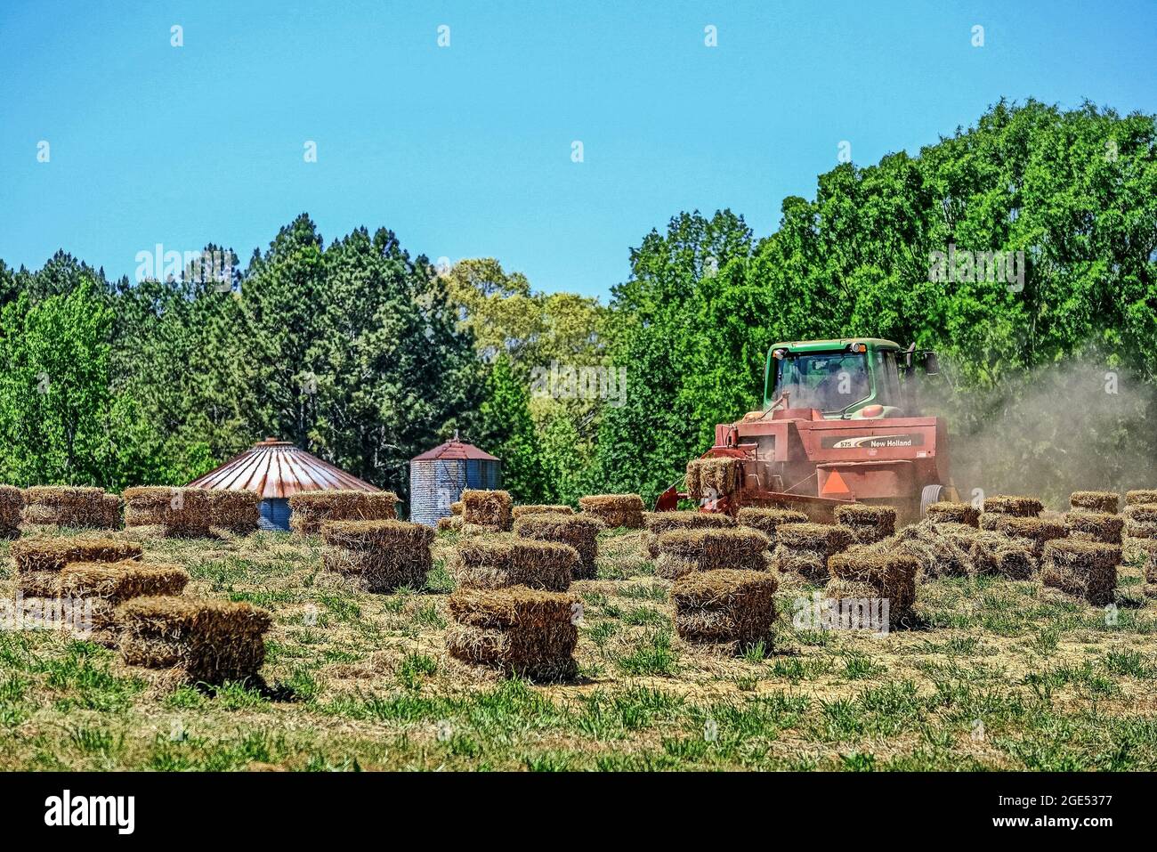 New Holland Tractor Baling Hay Stock Photo Alamy