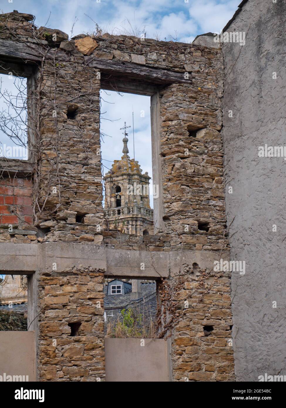 MONDONEDO, SPAIN - AUGUST 08, 2021: View of the cathedral in the town of Mondonedo thru the ruins,Lugo,Galicia,Spain Stock Photo