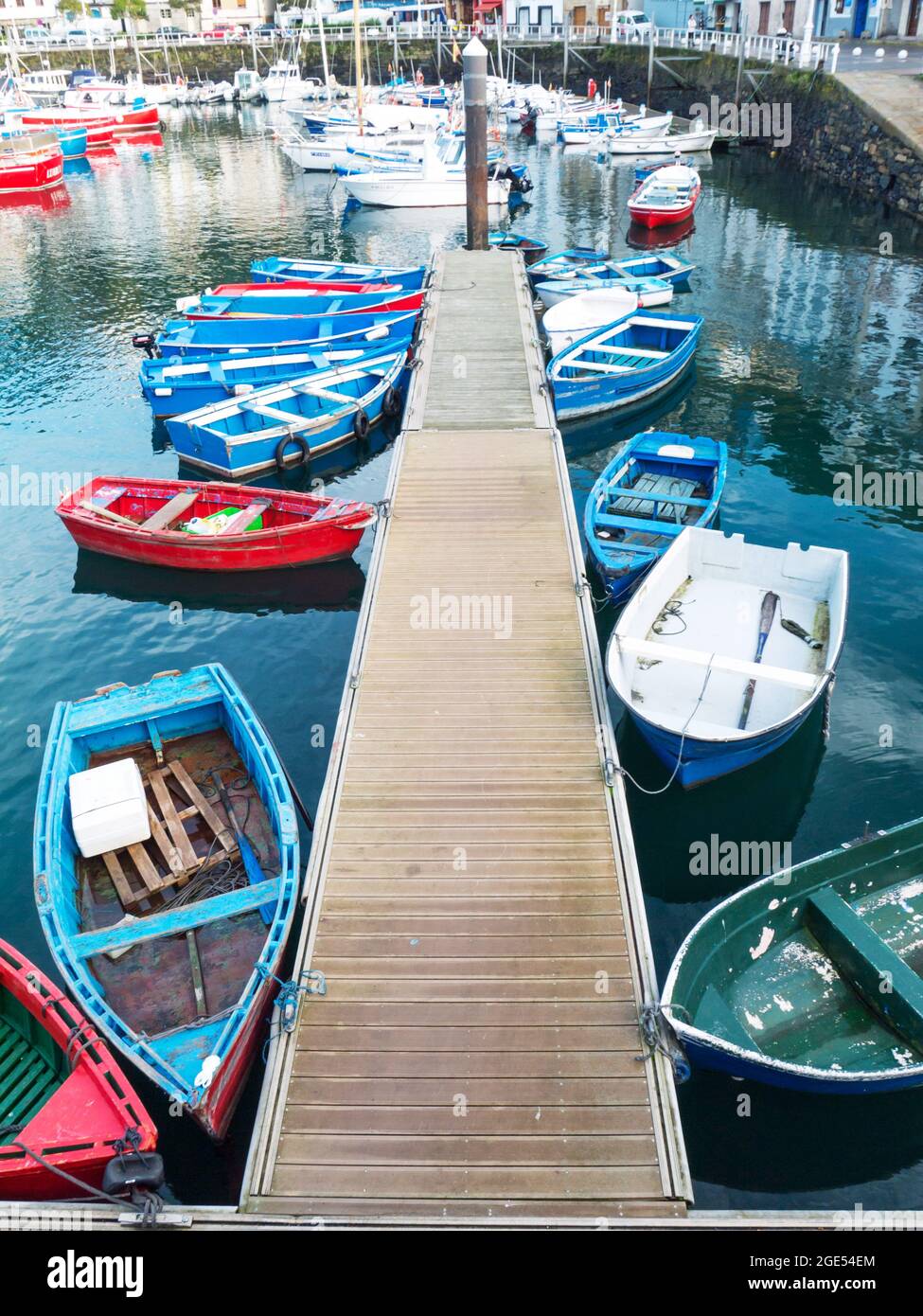 LUARCA, SPAIN - DECEMBER 4, 2016: Colorful boats at the fish market pier in Luarca, Spain. Stock Photo